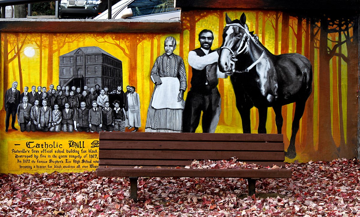mural from Triangle Park showing group of people and man and woman with a horse